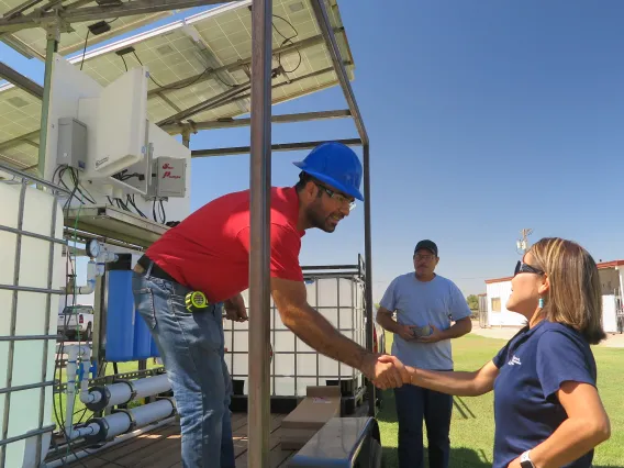 Dr. Chief shaking man's hand