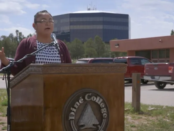 Screenshot from video of woman speaking at Dine Community College.