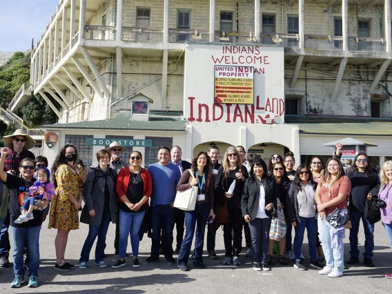 Members of the Native FEWS Alliance standing outside of a bookstore to pose for a group photo.