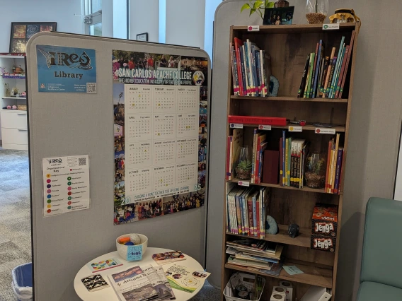 library signs and bookshelf with books