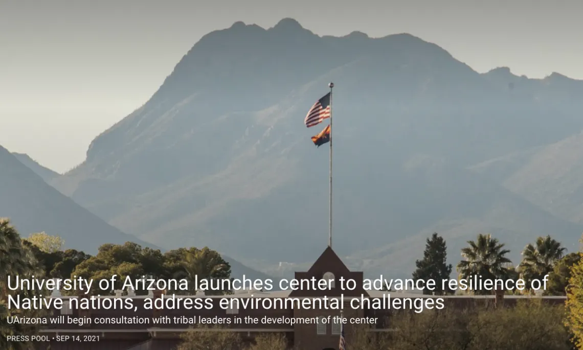 Mountain Landscape and a building flying an American flag