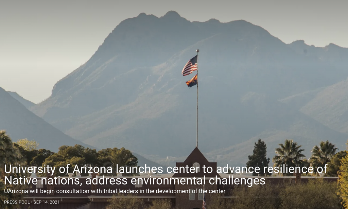 Mountain Landscape and a building flying an American flag