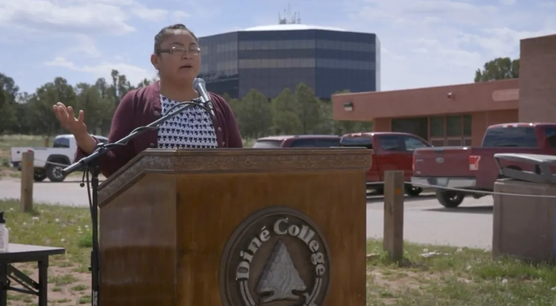 Screenshot from video of woman speaking at Dine Community College.