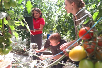 Dr. Chief in garden with students